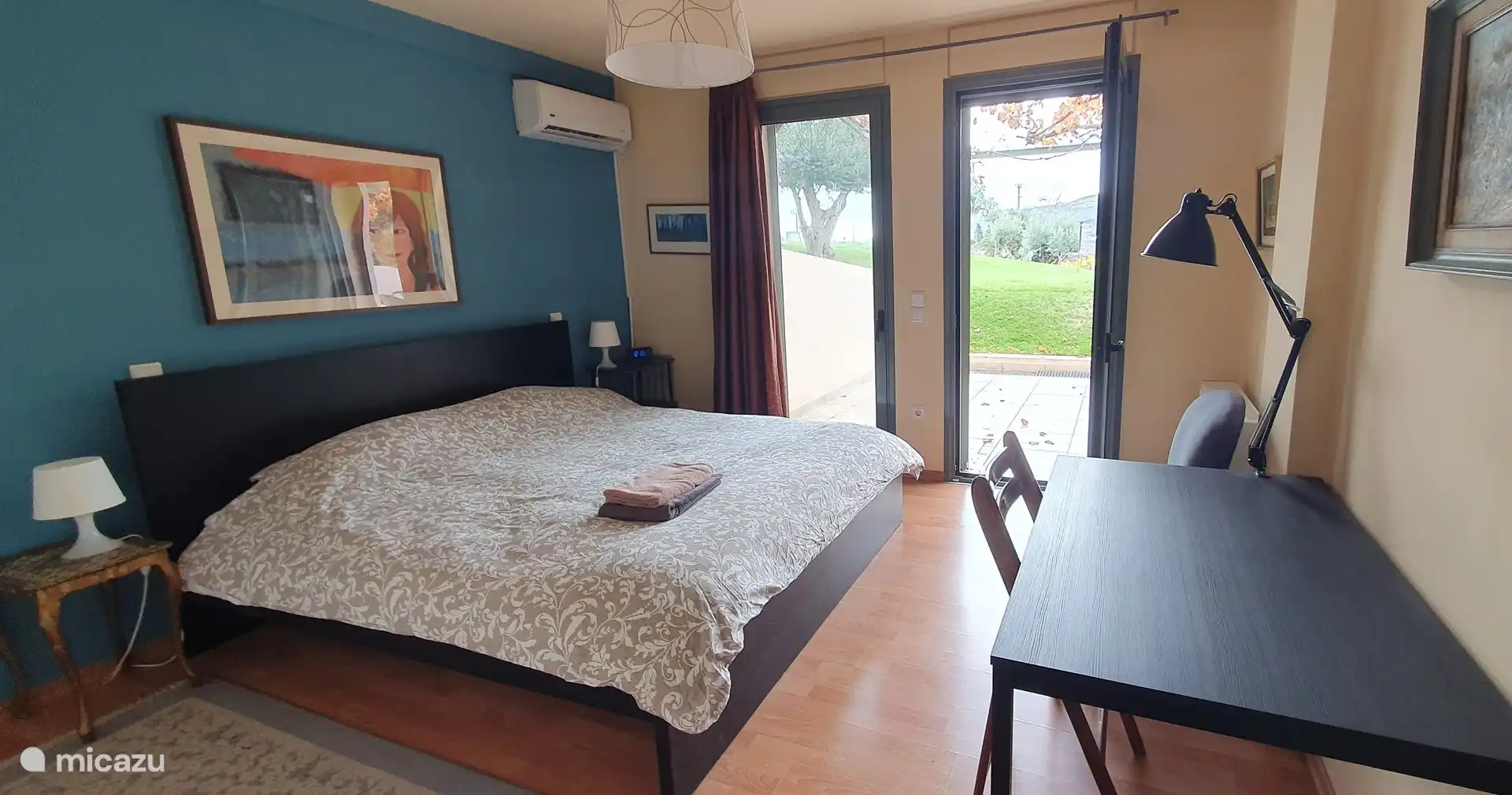 The extra bedroom with double bed in the basement.