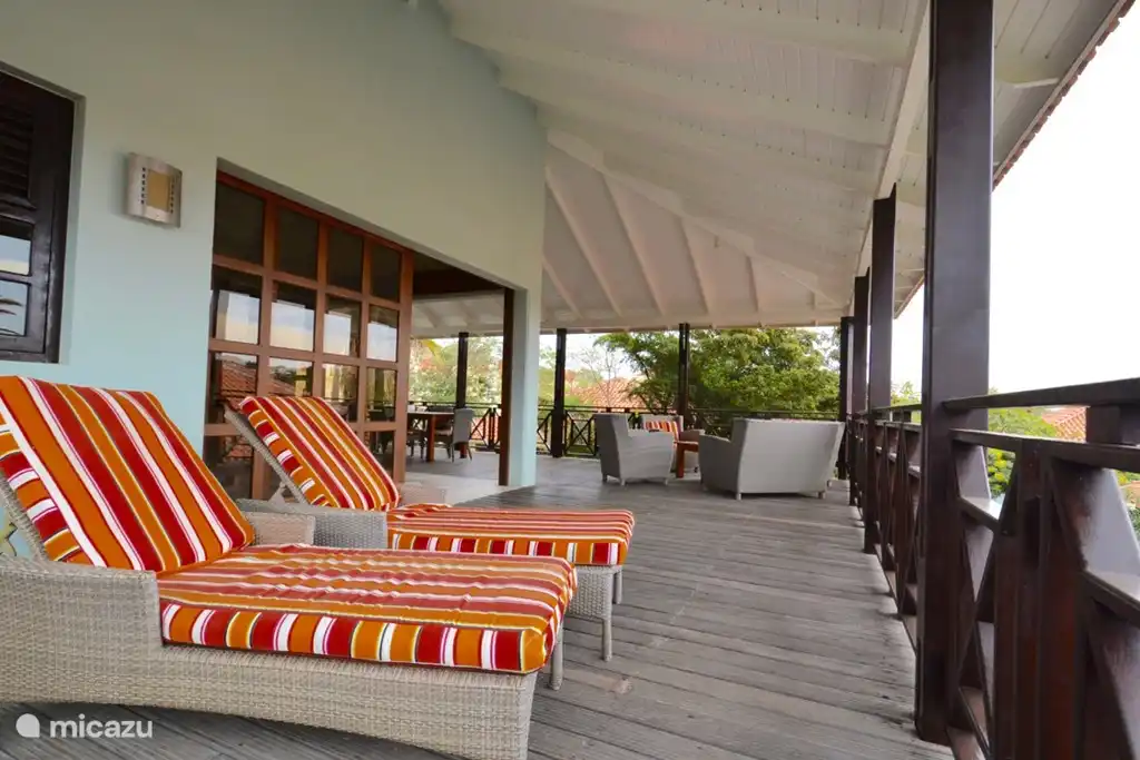 It is resting comfortably, reading or napping on the sunbeds!