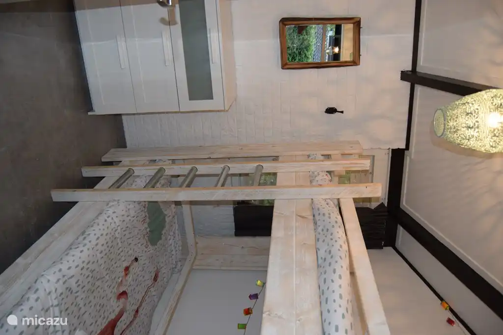 bedroom with bunk bed and drawer closet