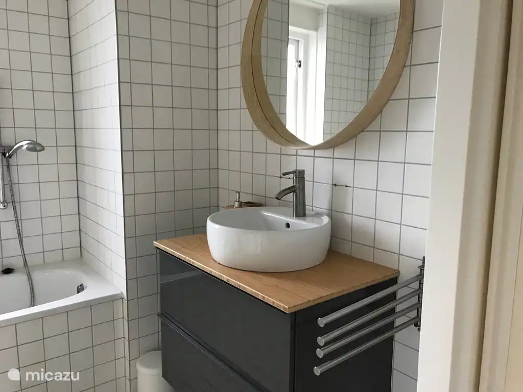 bathroom with bath and shower