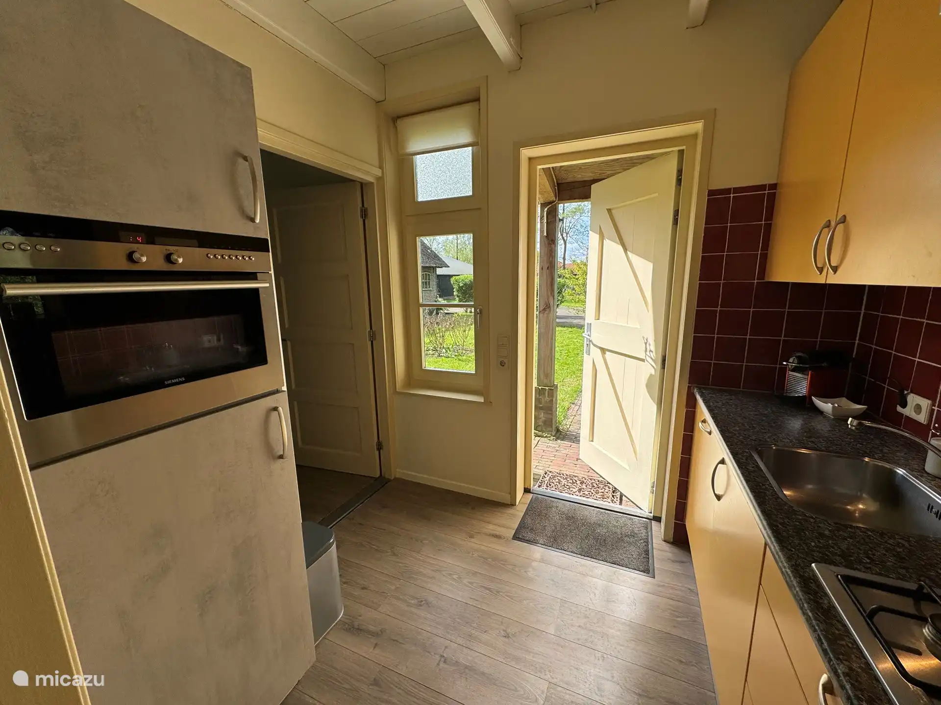 Kitchen with combination oven-microwave