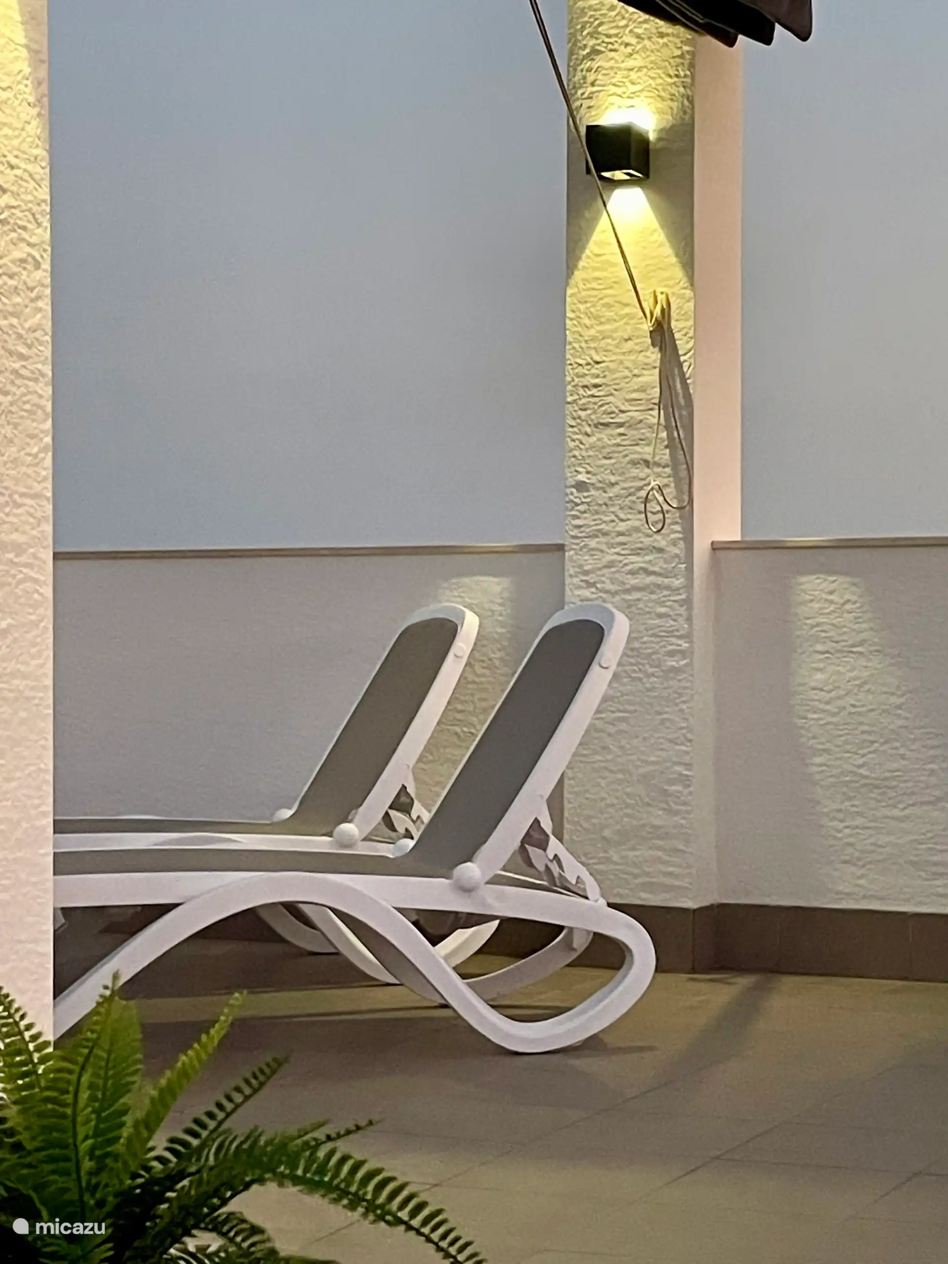 There are 4 luxury sun beds on the roof terrace