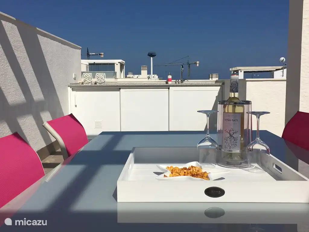 6 seater dining table with chairs and awnings. 