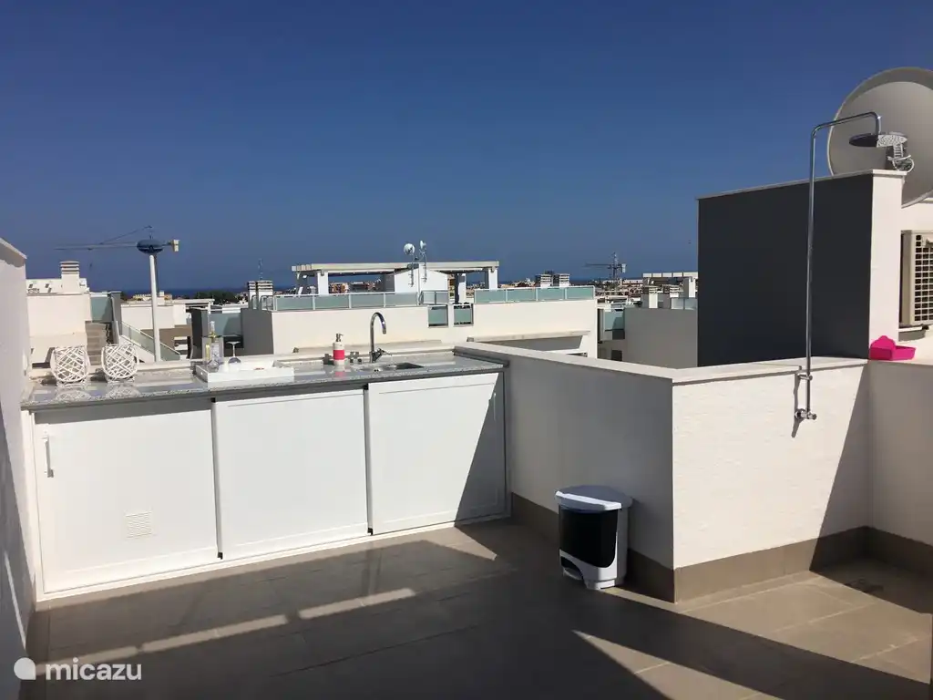 Outside kitchen and shower.