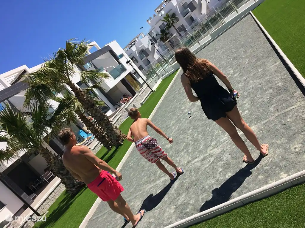 Garden with Jeu de Boules court and children&#39;s playground.
