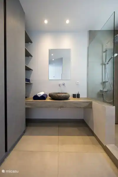 Ensuite bathroom with dressing