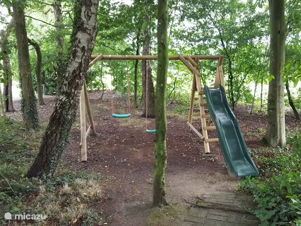 And the playground with swings and slide. There is also a sandbox!