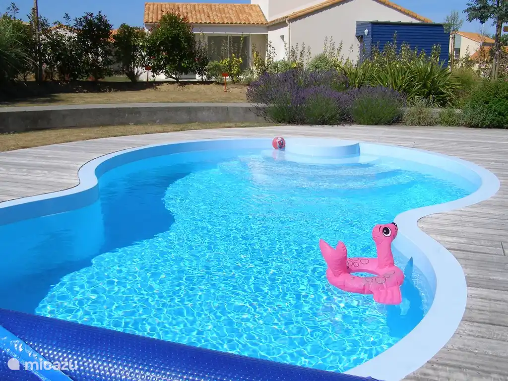 Pool with wooden floor around