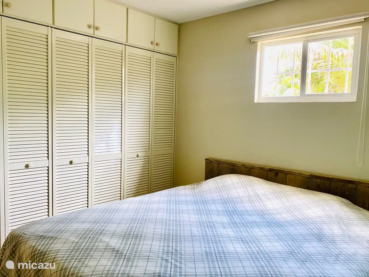 Master bedroom with high king size bed (180cm wide x 200cm long) with good quality mattress and a topper. Both bedrooms have more than enough closet space. The master bedroom has a small desk.