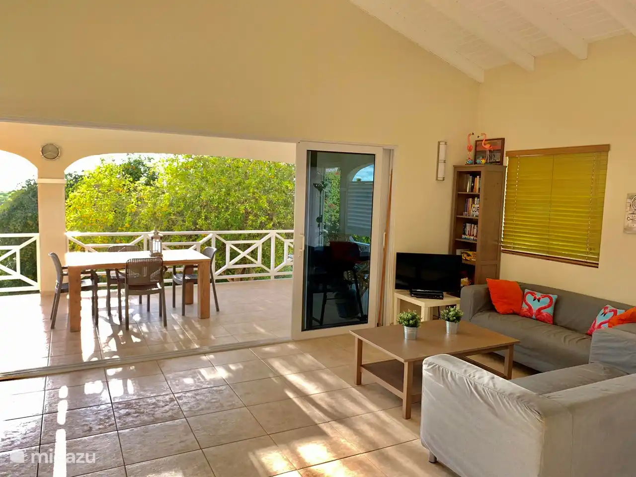 Living room with spacious terrace and (out of sight) on the left the open kitchen. It forms a large space where you can relax.