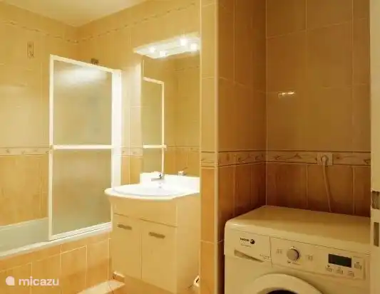 Spacious bathroom with washing machine