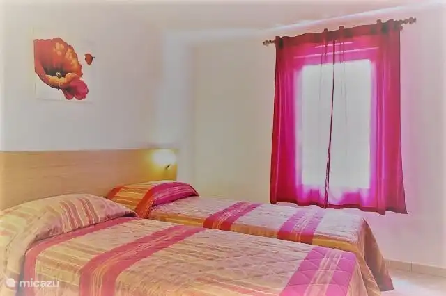 One of 3 spacious bedrooms with lots of closet space with sliding doors