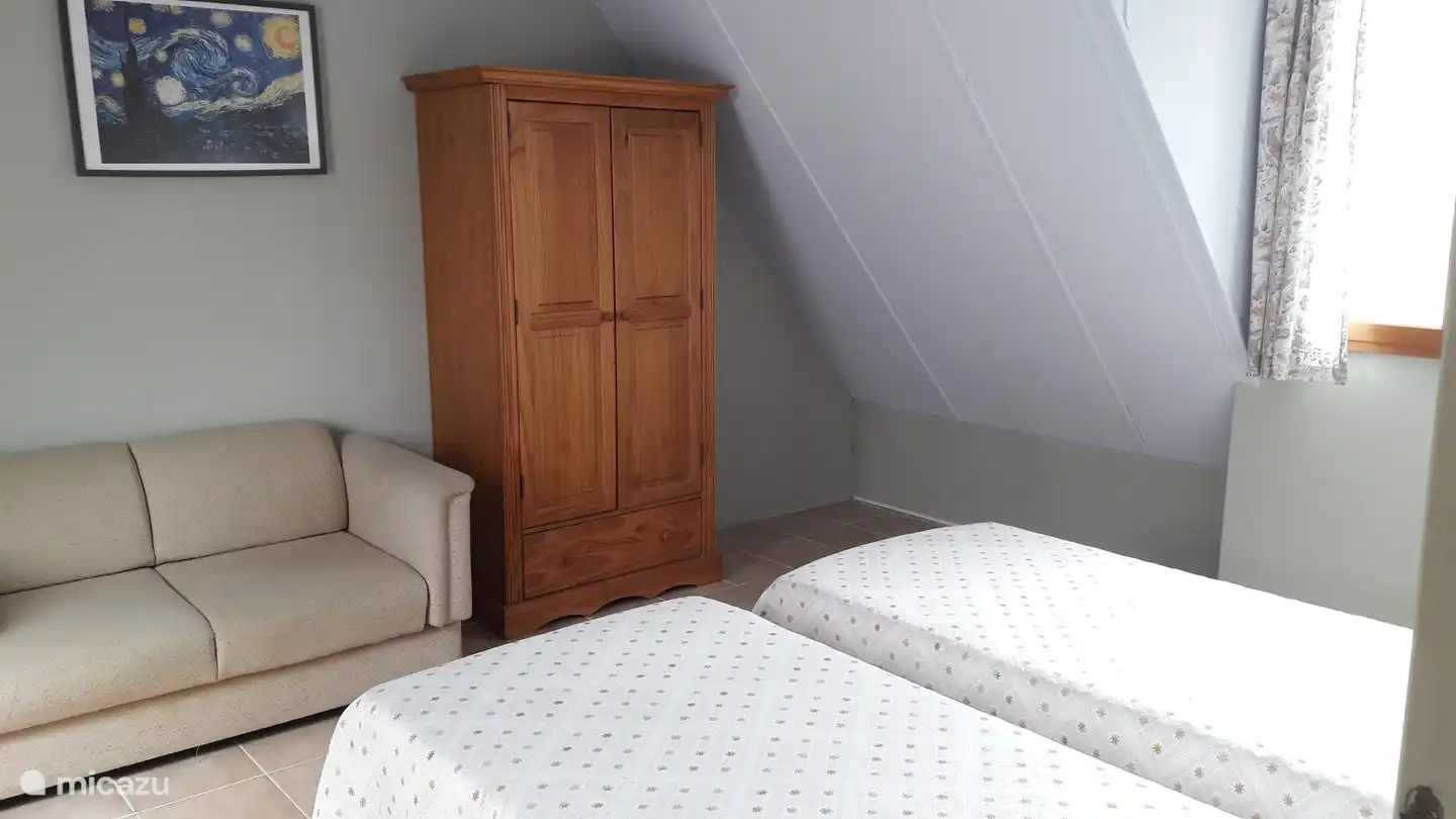 On the first floor you will find a bedroom with two single beds and a sofa bed.