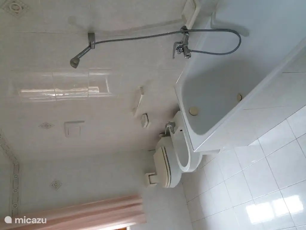 Bathroom with bathtub and shower