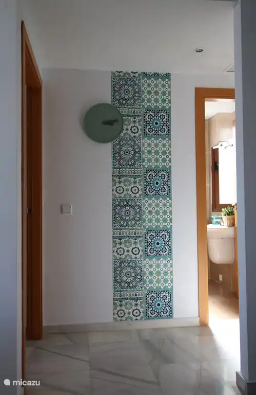 Entrance from living room to 2nd and 3rd bedroom and 2nd bathroom