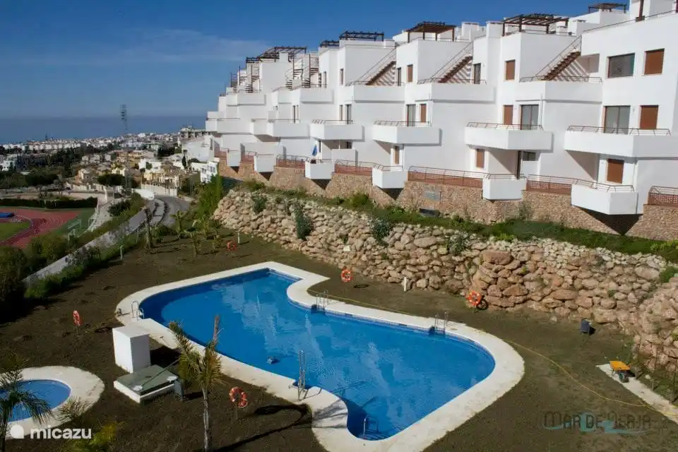 Complex with pool and view