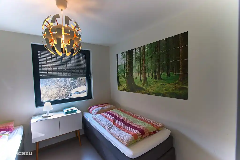 Chambre 1 au rez-de-chaussée avec deux lits simples