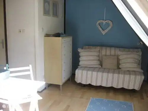 Palier spacieux avec canapé-lit.