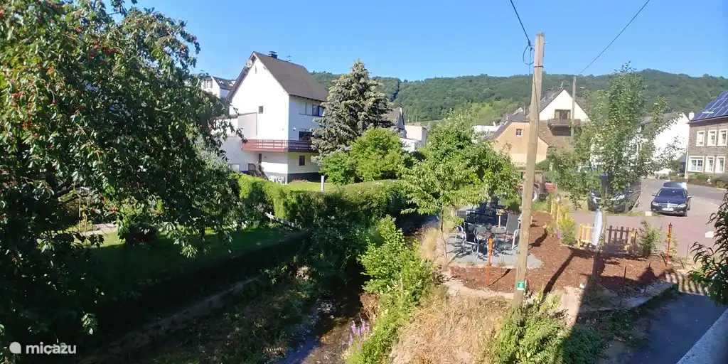 View garden, terrace, parking space and stream