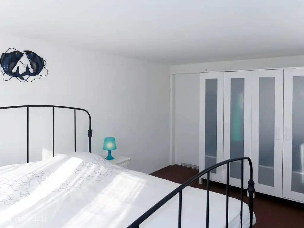 2 person bedroom downstairs with space for a baby bed.