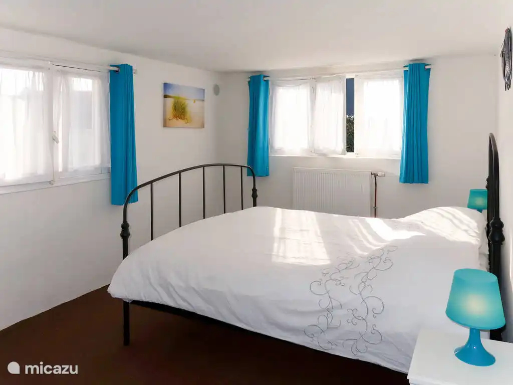 2 person bedroom downstairs with space for a baby bed.