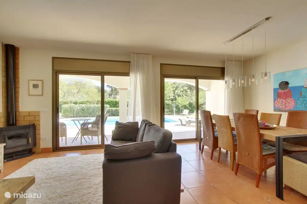 Dining area and living area with fireplace