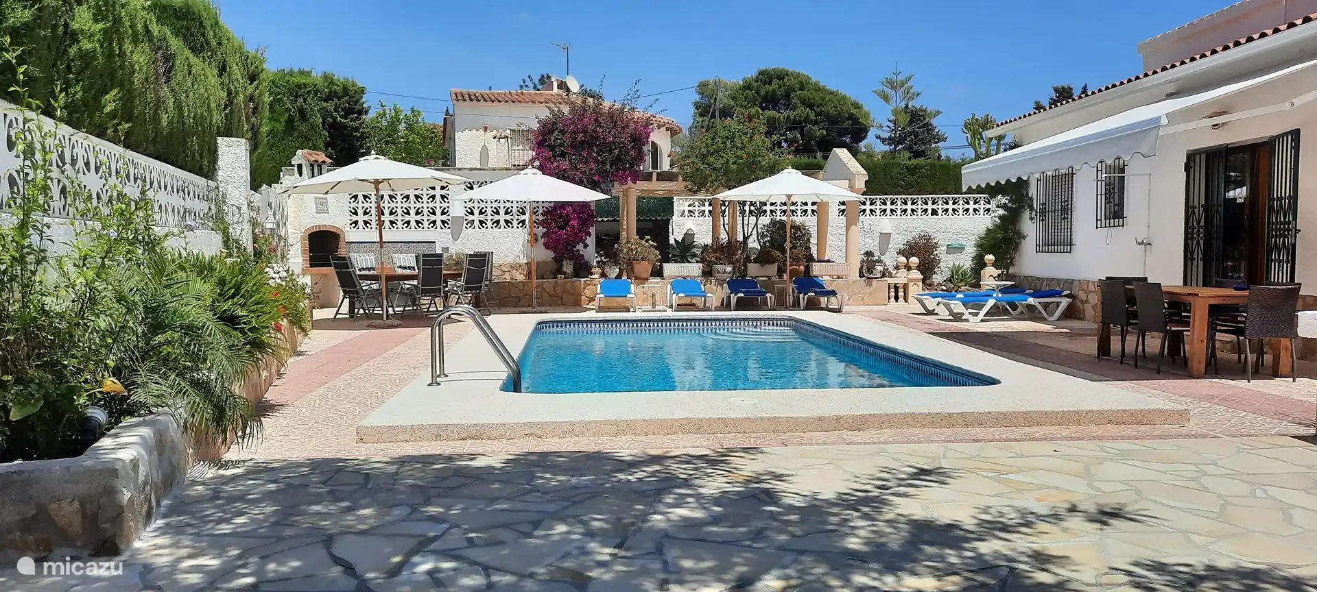 Comfortable sunbeds and a parasol. What more could a person want?