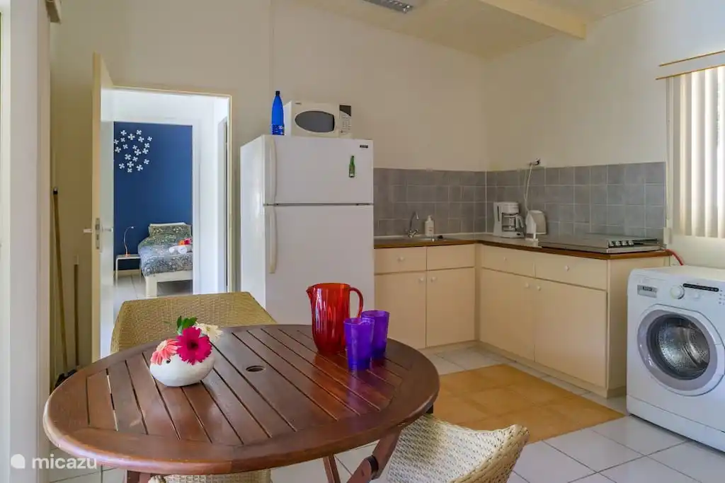 Complete kitchen with gas stove, fridge-freezer, coffee maker, kettle, mixer, egg cooker, juicer and washing machine