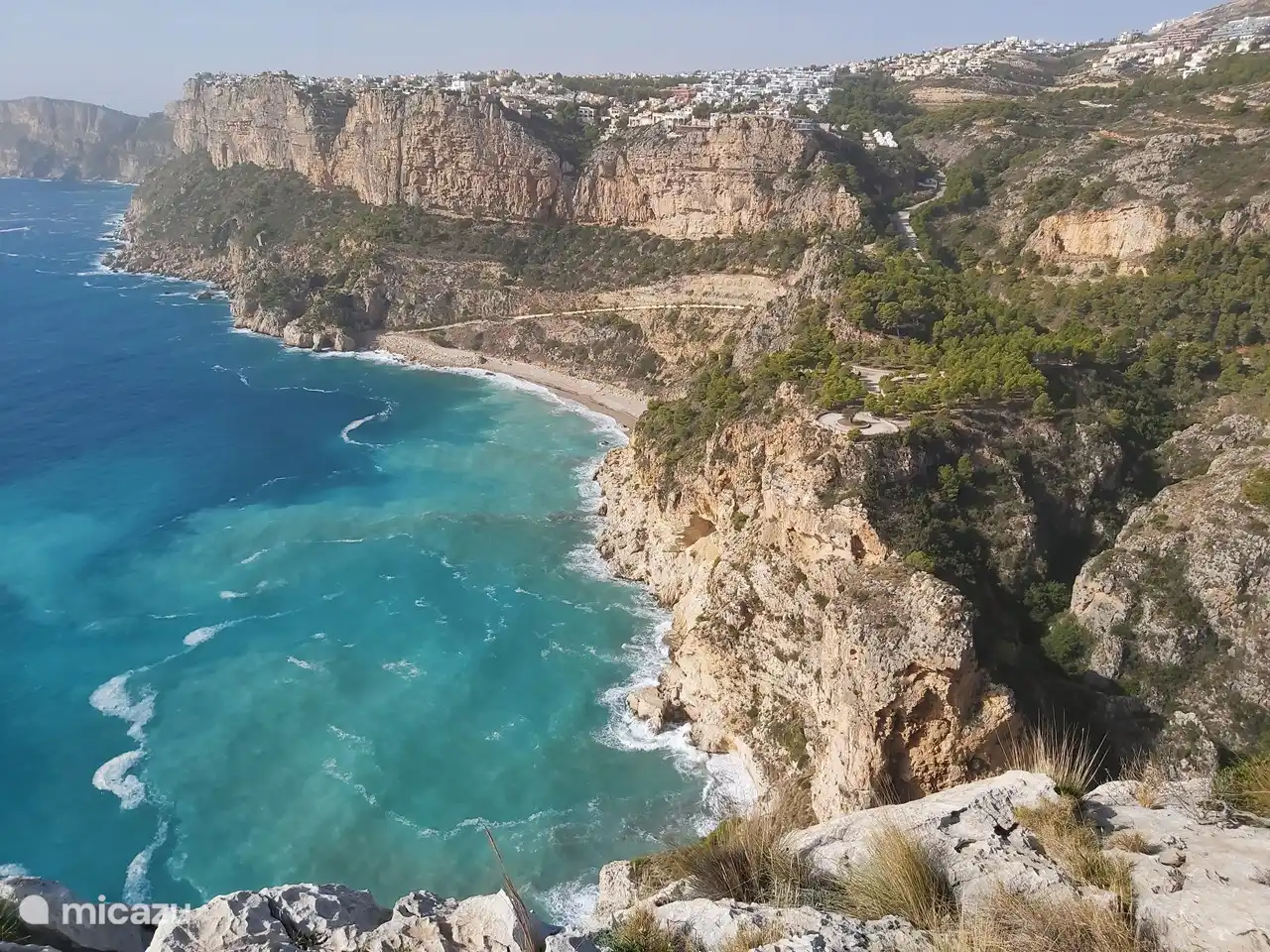 View from El Morro Falqui on the beach of Cala de Moraig