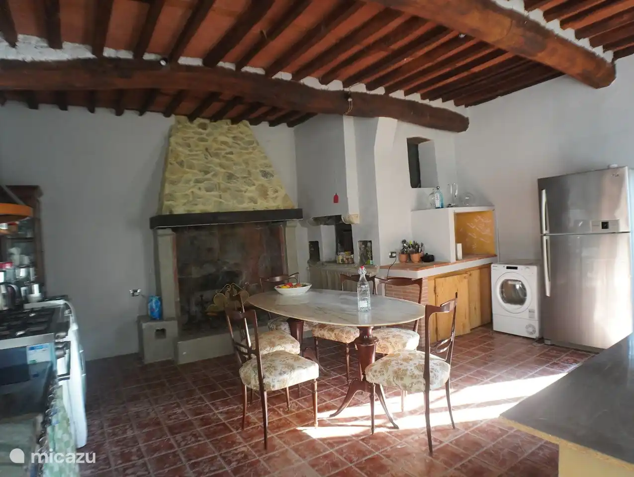 The kitchen has a working fireplace and ancient bread oven (not in use)