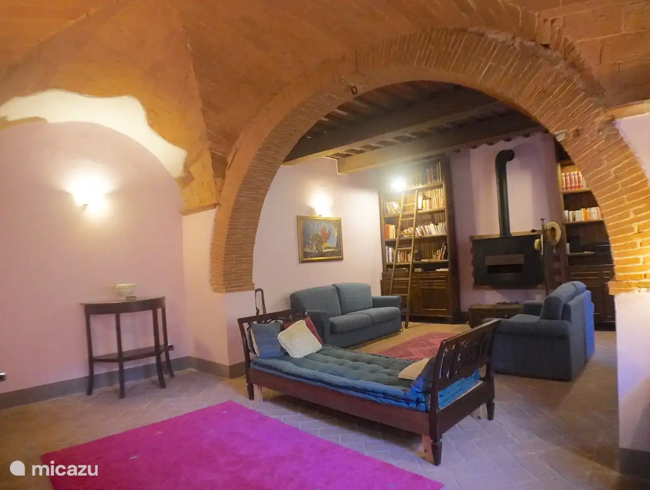 The living room has a wood-burning fireplace