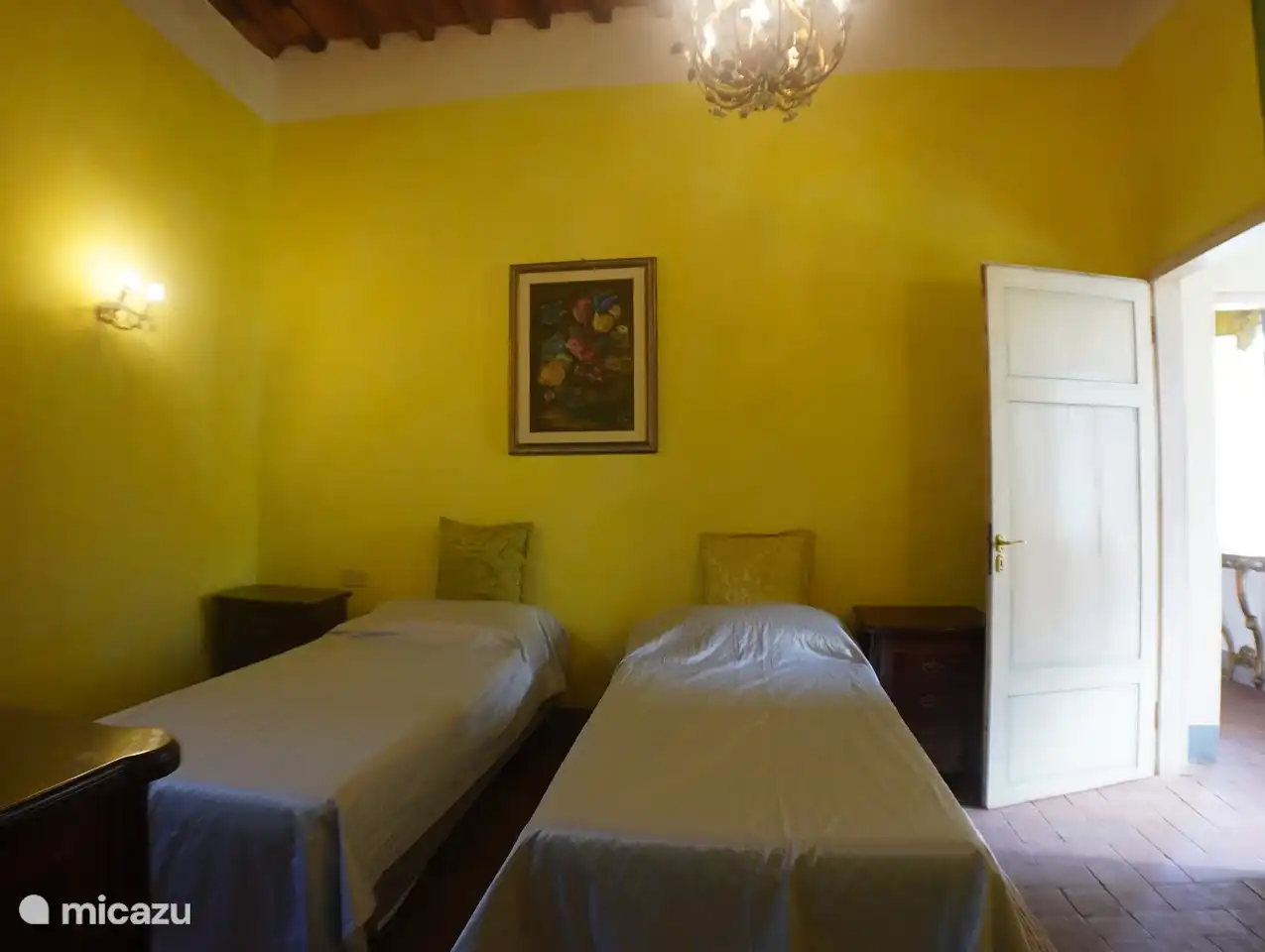 Middle bedroom with twin beds (can be made into double) and bathroom with bath. Windows face north, so this is a cooler room in Summer.