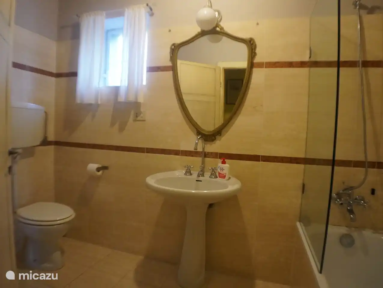 The bathroom with bath (middle room).