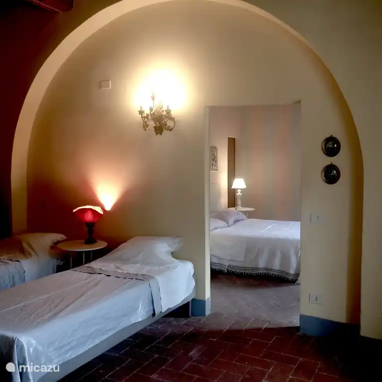 The Stripe Suite. This bedroom has two single beds and is next door a double bedroom and bathroom. Ideal for a family or friends.