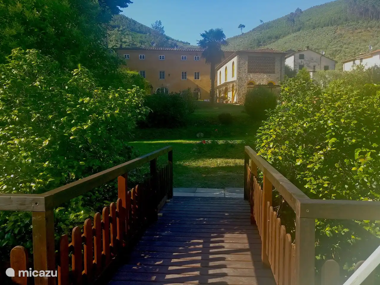 A walkway from the gated pool takes you to the round rose bed lawn ideal for sunbathing or lounging in the shade.   