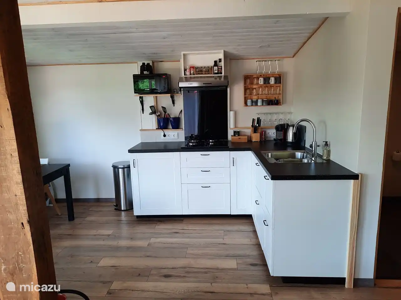 well-equipped kitchen with Nespresso coffee machine and microwave