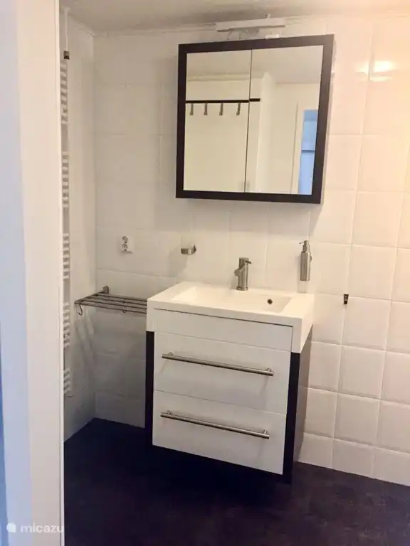 The bathroom with toilet and shower