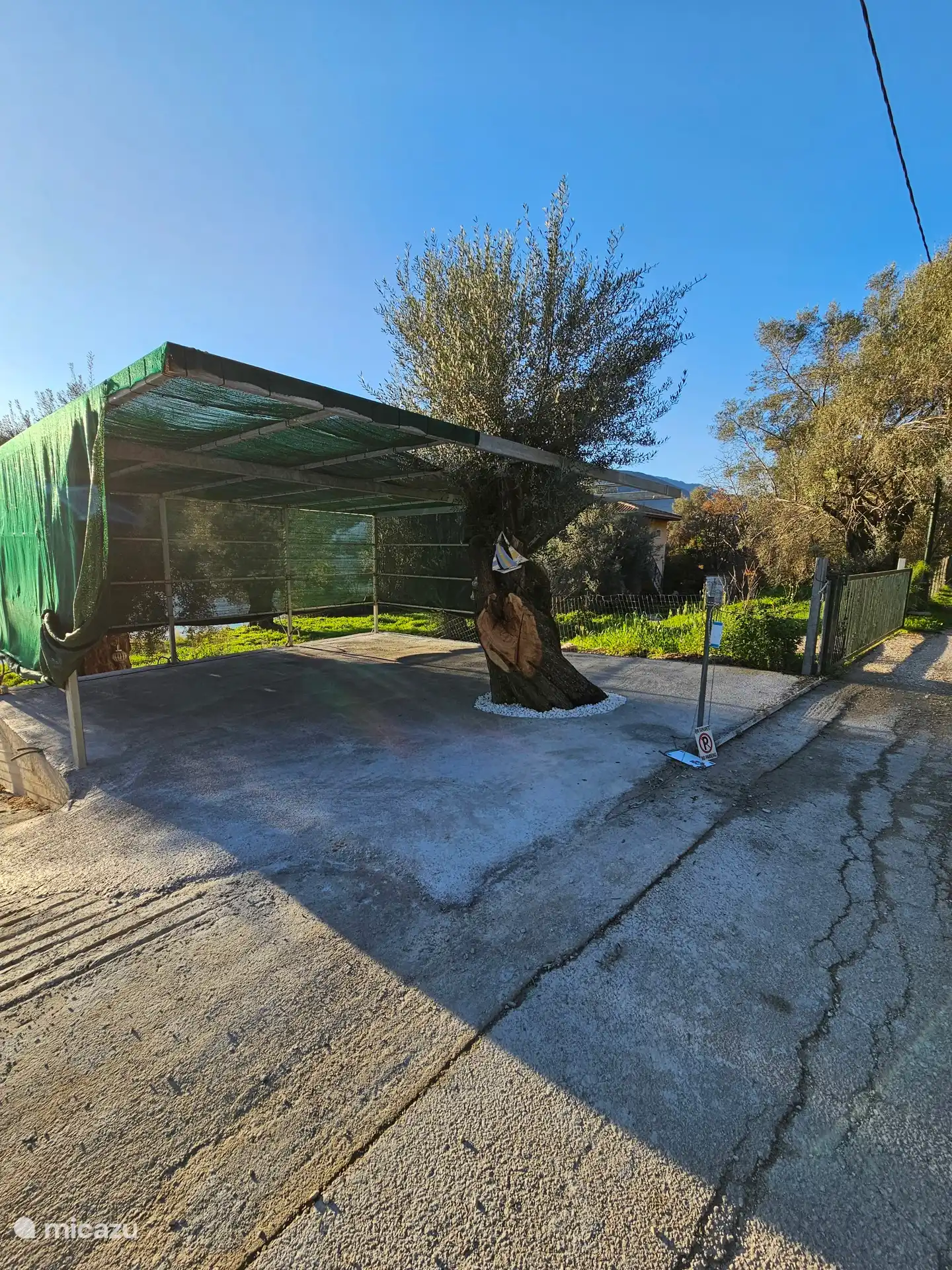 Private parking with space for two cars and a scooter