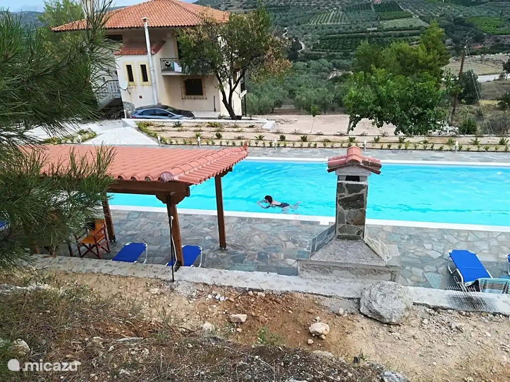 Our swimming pool with pergola and barbecue