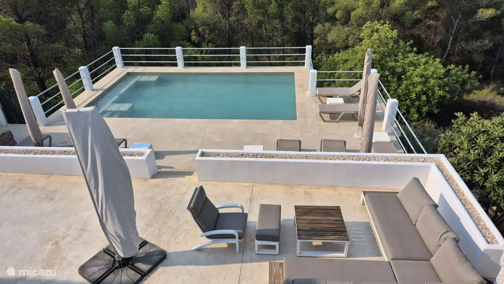 Swimming pool with lounge sofa and beds