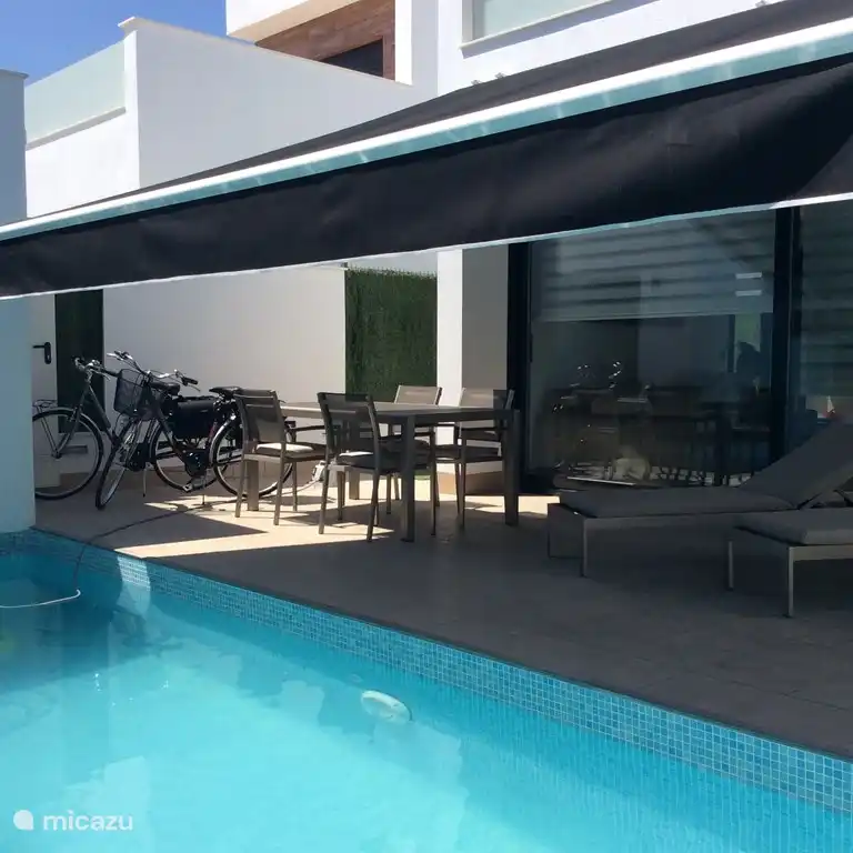 Swimming pool, terrace, terrace furniture, bicycles, awning