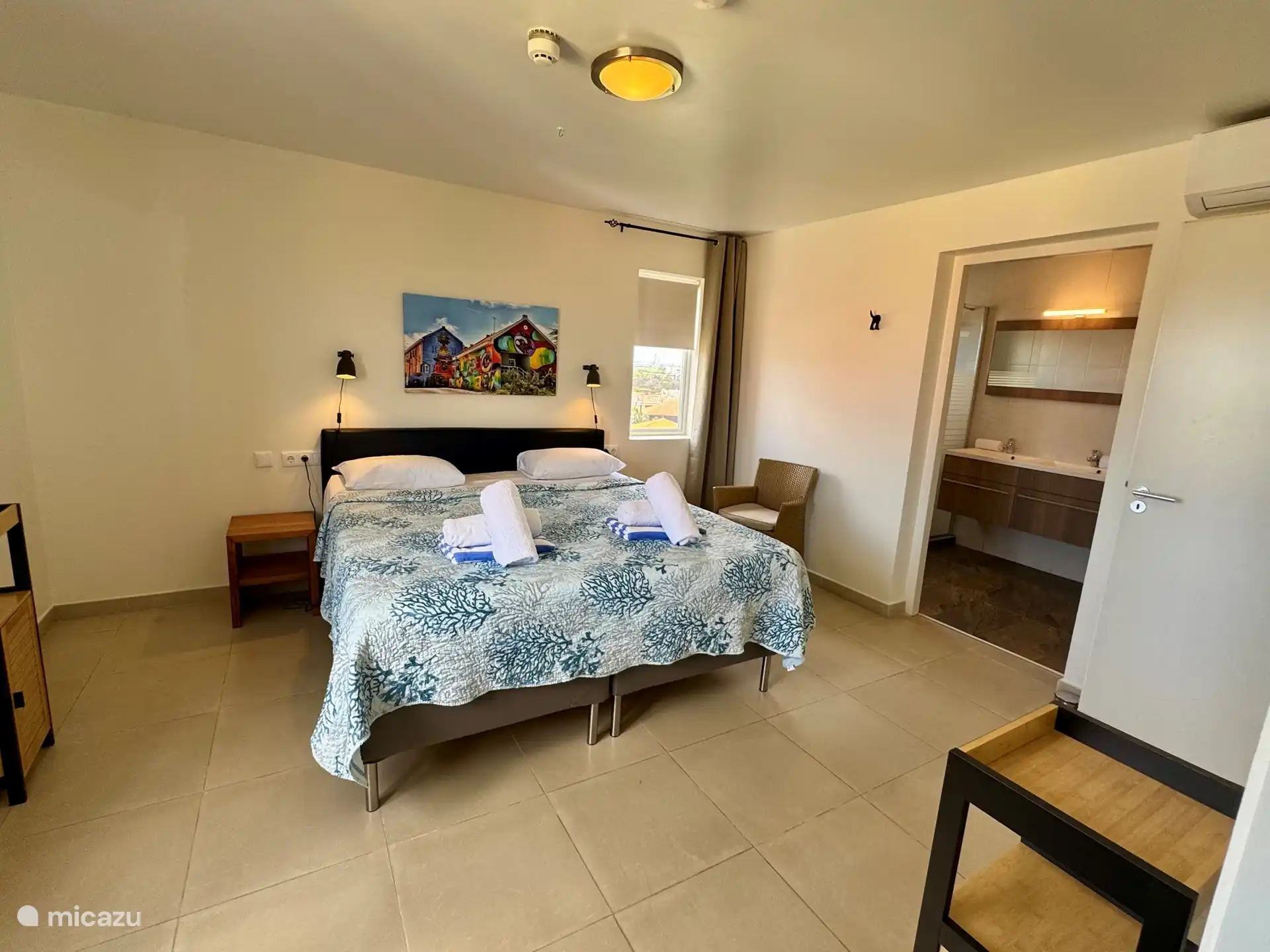 Master bedroom with bathroom and walk-in closet