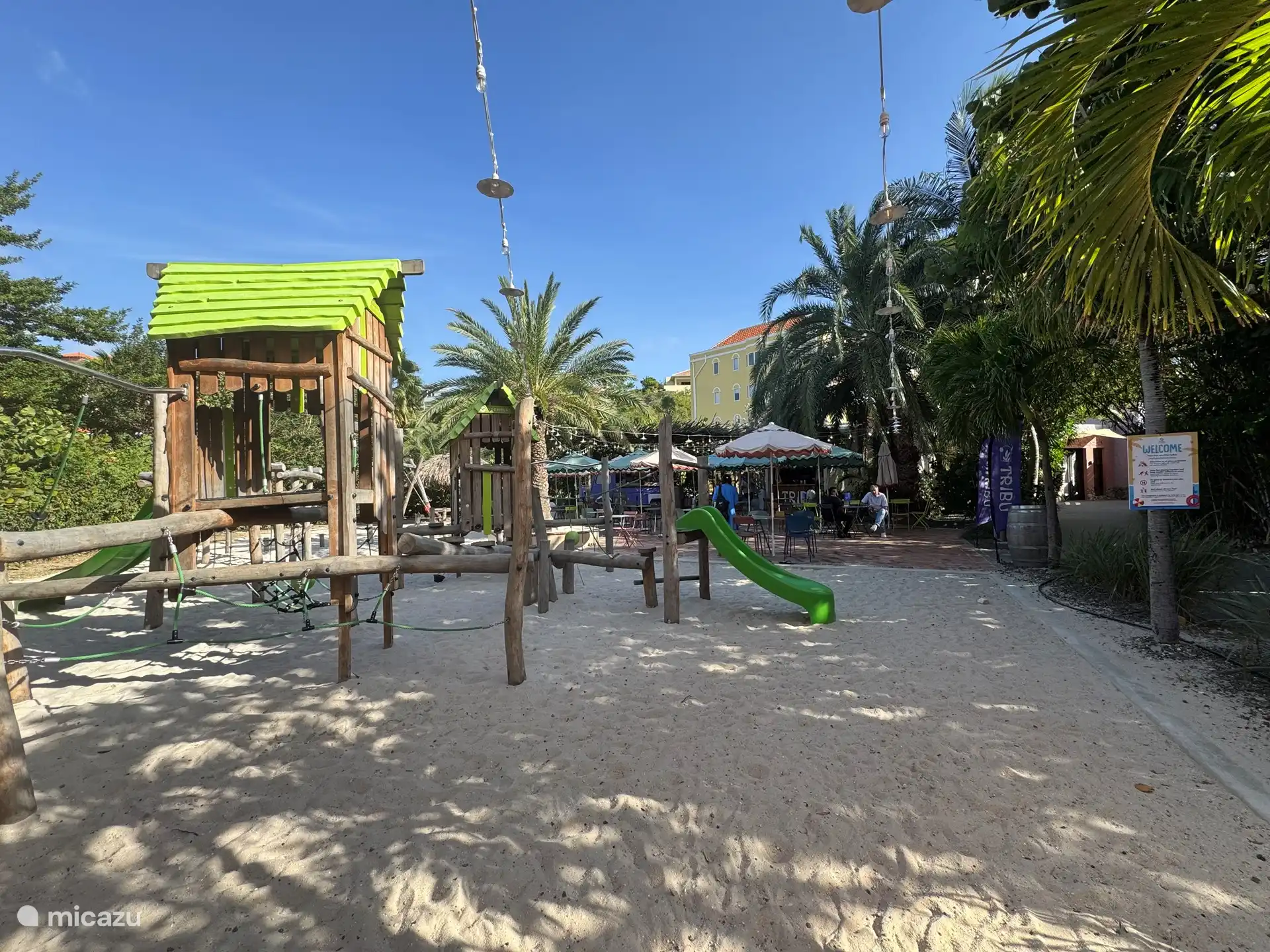 Beachfront playground and Tribu food truck serving snacks and pizza