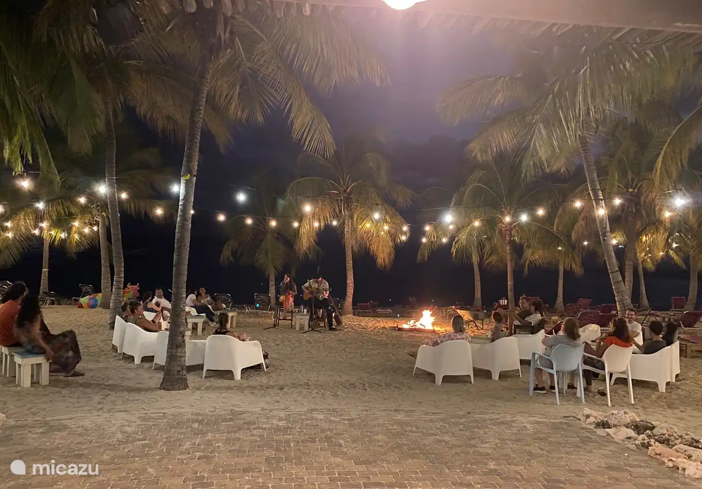 Campfire evening with live music on the beach