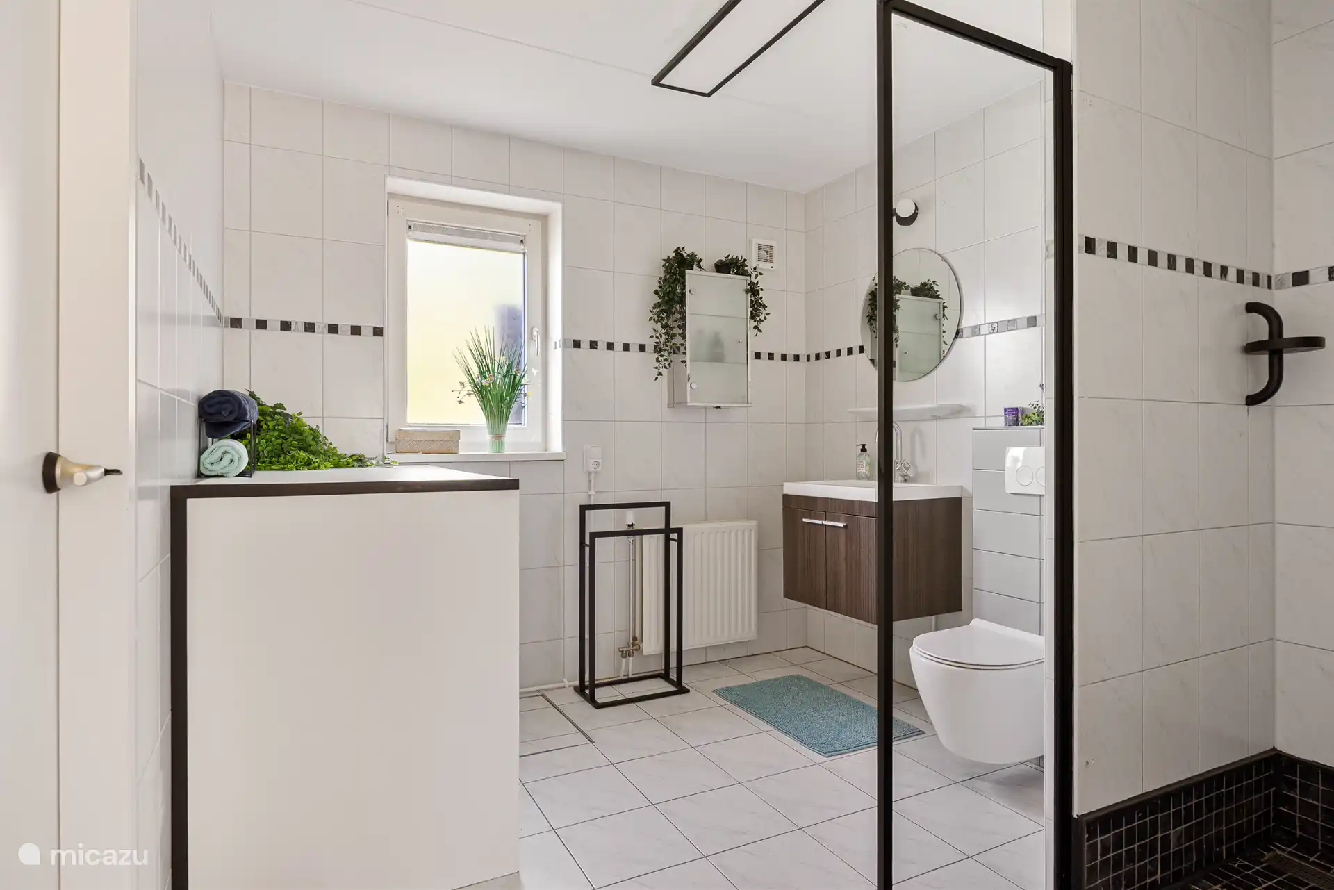 En suite bathroom ground floor with shower, sink and toilet