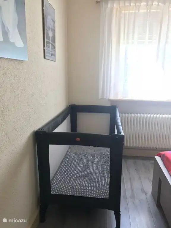 baby bed in master bedroom