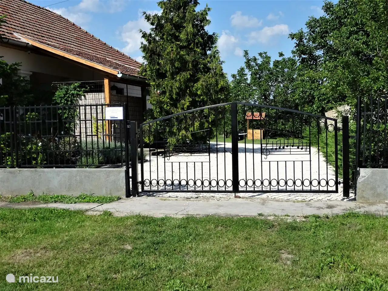 entrance gate with parking behind it