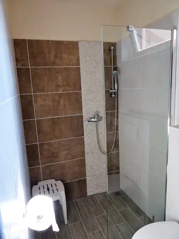 Bathroom with shower, sink and toilet