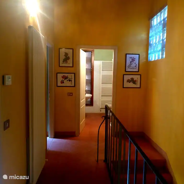 Landing on the first floor, overlooking one of the three bathrooms.