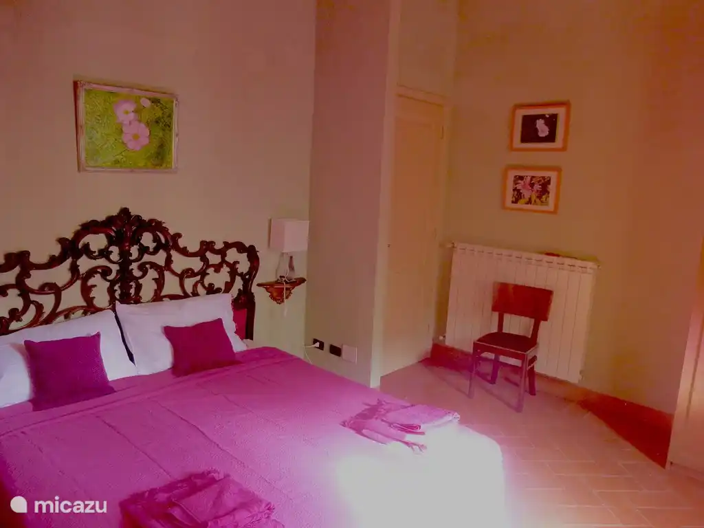 Pink bedroom, double bed, ensuite bathroom.